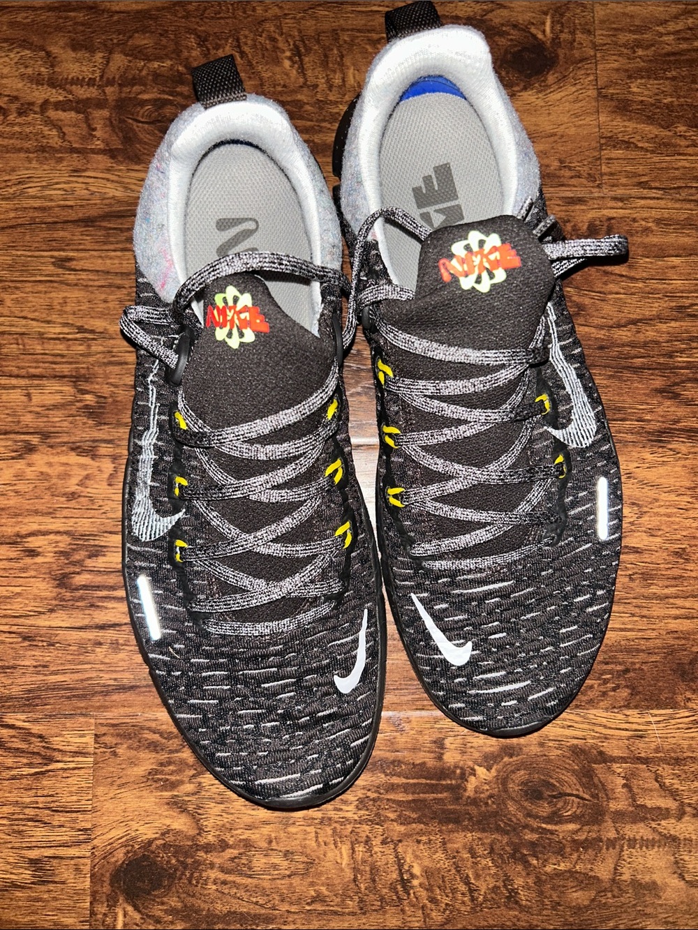 Nike Black Athletic Running Shoes with Yellow Accents